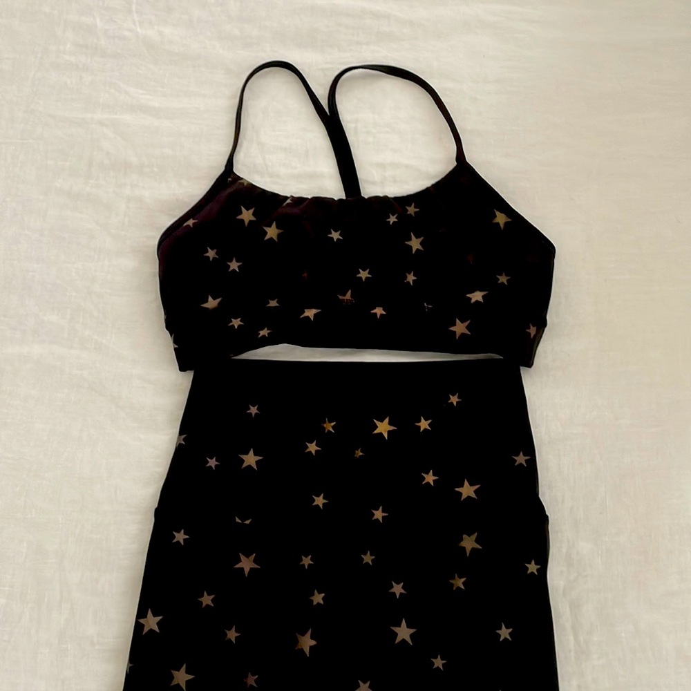 CHRLDR Yoga set. Black with muted gold stars. Size M top and size XS bottoms.